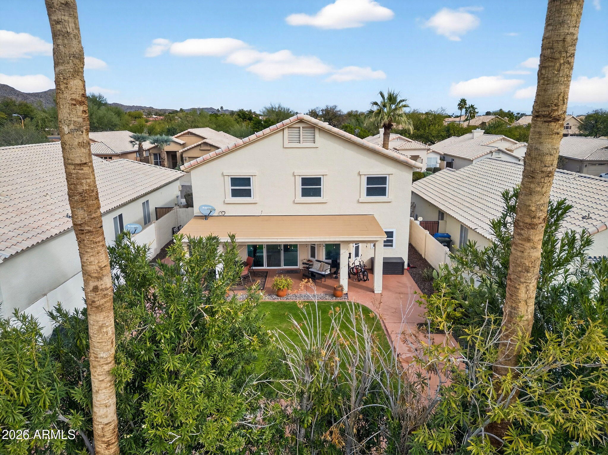 3615 East Desert Willow Road Phoenix, AZ 85044 - Photo 51 of 65 an aerial view of a house with a big yard and potted plants