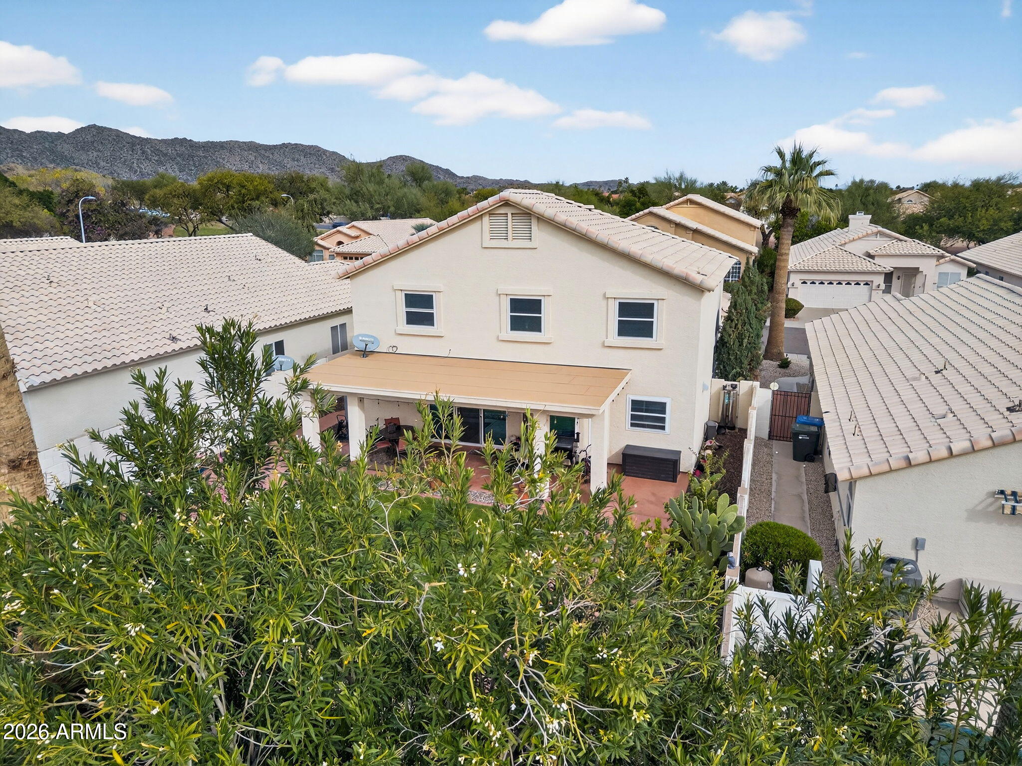 3615 East Desert Willow Road Phoenix, AZ 85044 - Photo 53 of 65 an aerial view of a house with a yard and potted plants
