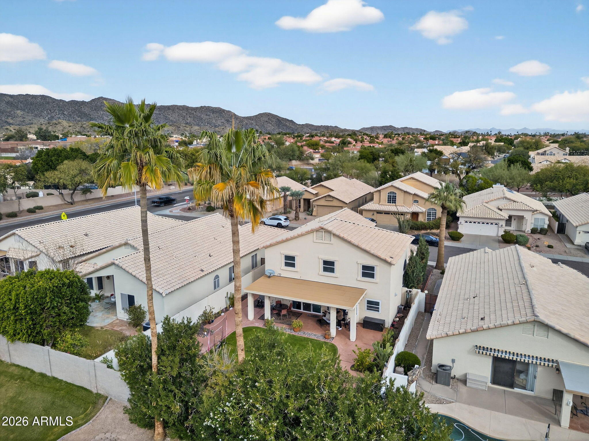 3615 East Desert Willow Road Phoenix, AZ 85044 - Photo 59 of 65 an aerial view of residential houses with outdoor space and trees