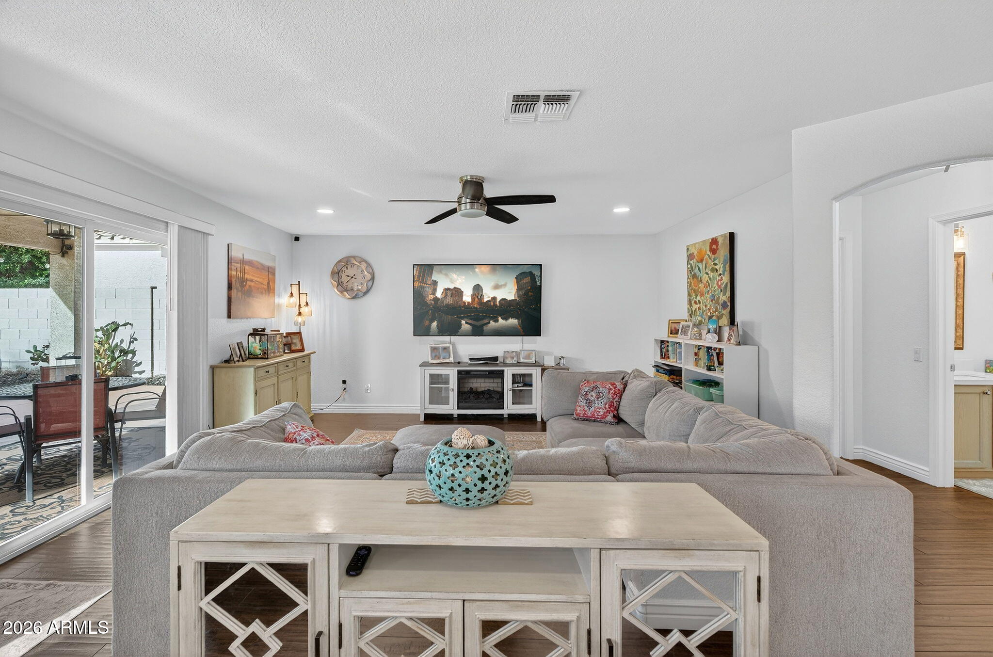 3615 East Desert Willow Road Phoenix, AZ 85044 - Photo 5 of 65 a living room with furniture and a flat screen tv