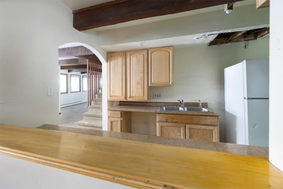 200 Evergreen Road Dillon, CO 80435 - Photo 16 of 35 a kitchen with stainless steel appliances granite countertop a sink and a refrigerator