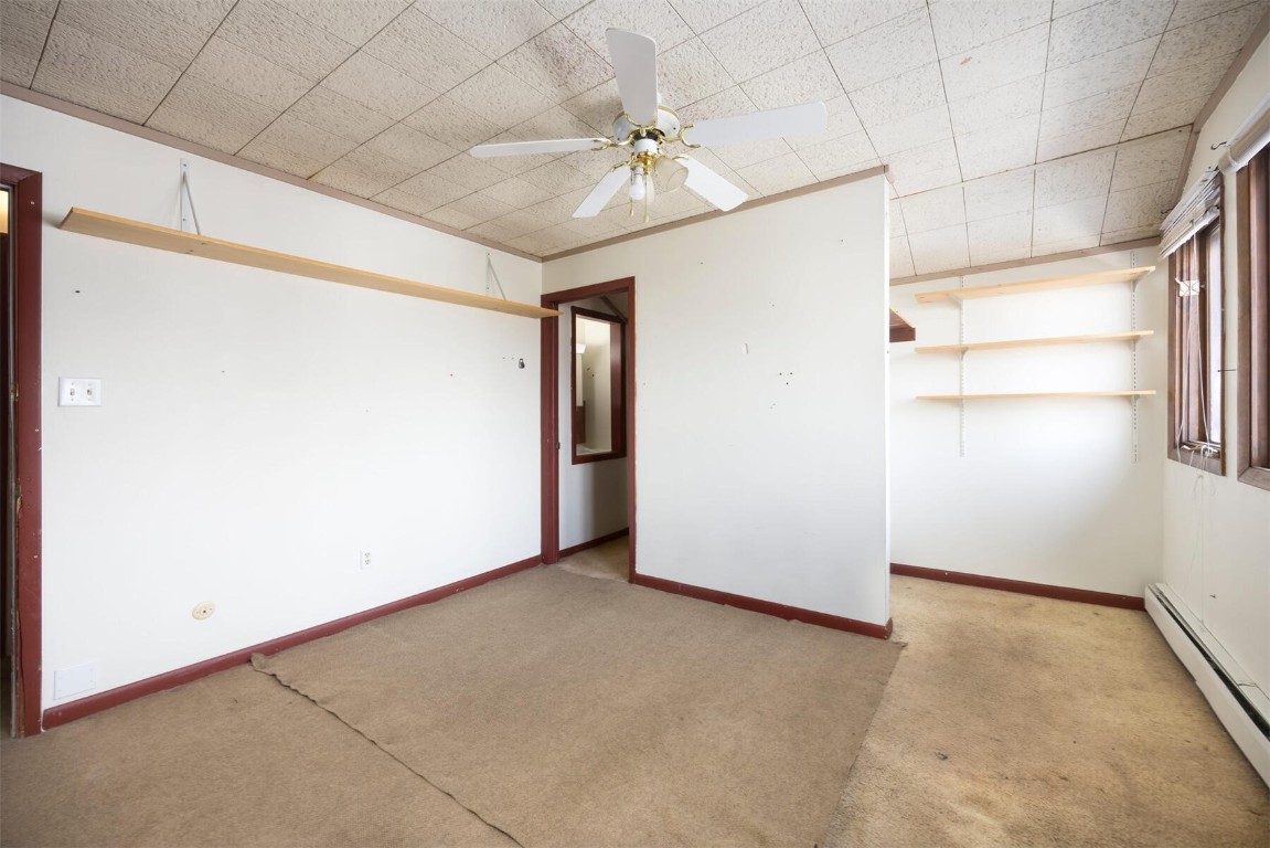 200 Evergreen Road Dillon, CO 80435 - Photo 26 of 35 an empty room with a ceiling fan and windows