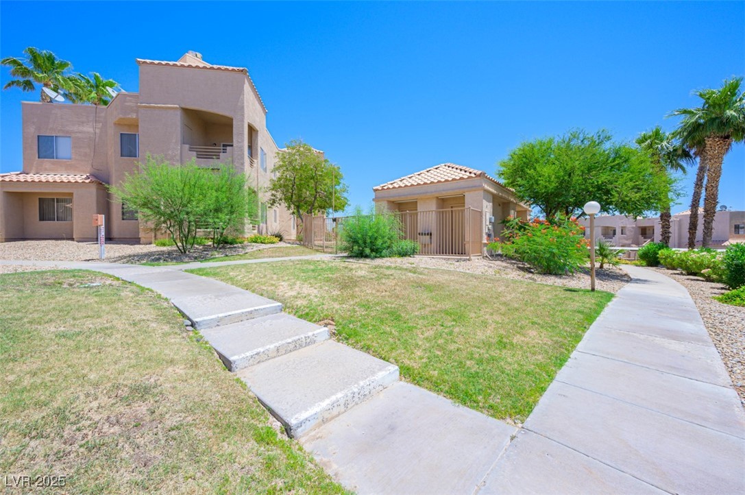 2240 Highpointe Drive, Unit 203 Laughlin, NV 89029 - Photo 11 of 38 Surrounding community featuring fence and a yard