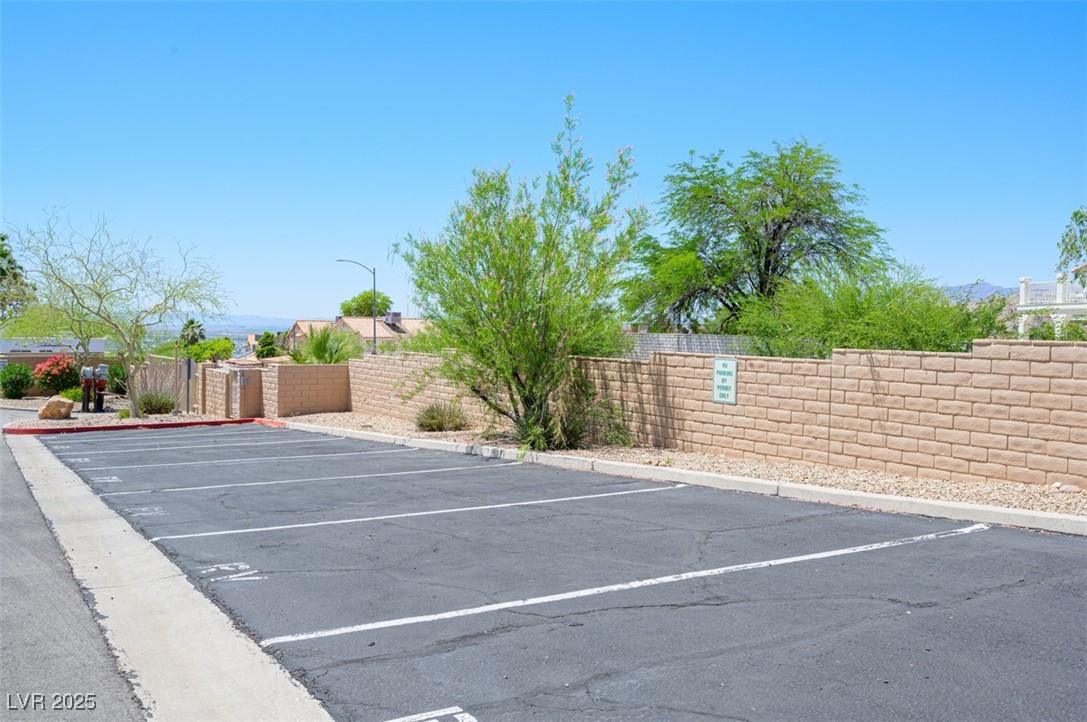 2240 Highpointe Drive, Unit 203 Laughlin, NV 89029 - Photo 38 of 38 Uncovered parking lot with fence