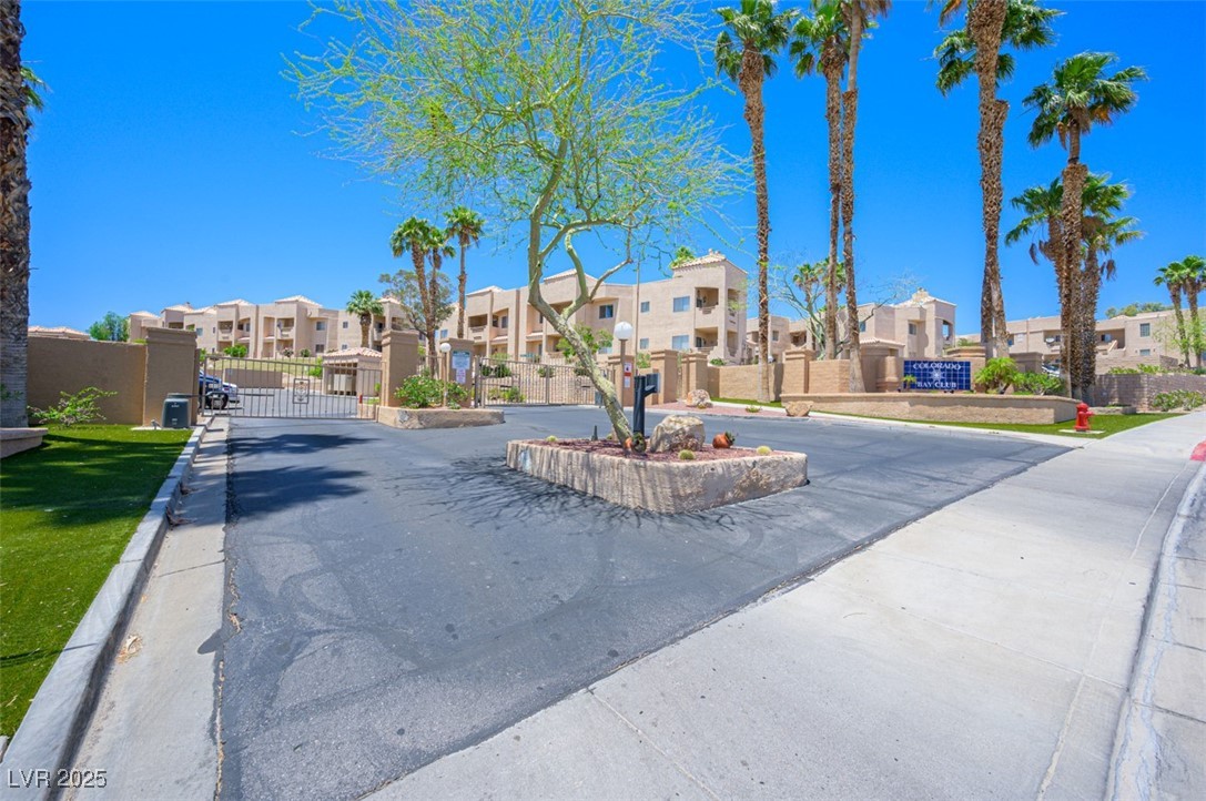 2240 Highpointe Drive, Unit 203 Laughlin, NV 89029 - Photo 5 of 38 View of road featuring a gated entry, a residential view, a gate, and curbs
