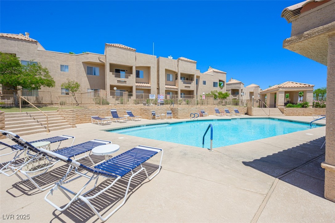 2240 Highpointe Drive, Unit 203 Laughlin, NV 89029 - Photo 6 of 38 Pool with a patio, fence, and a residential view