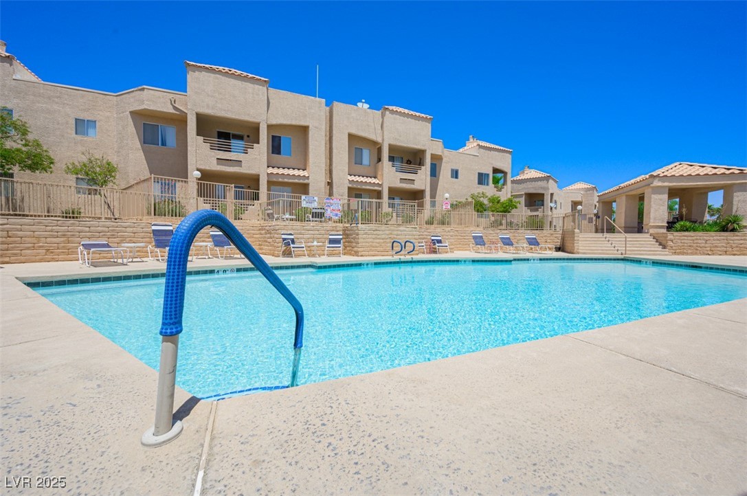 2240 Highpointe Drive, Unit 203 Laughlin, NV 89029 - Photo 6 of 38 Community pool featuring fence and a residential view