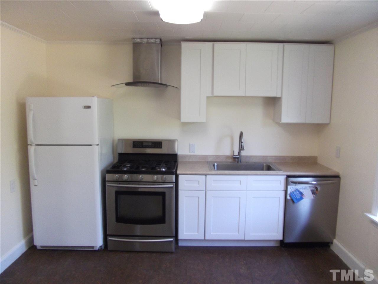 1102 Stallings Road Durham, NC 27703 - Photo 8 of 15 a kitchen with cabinets appliances and a sink