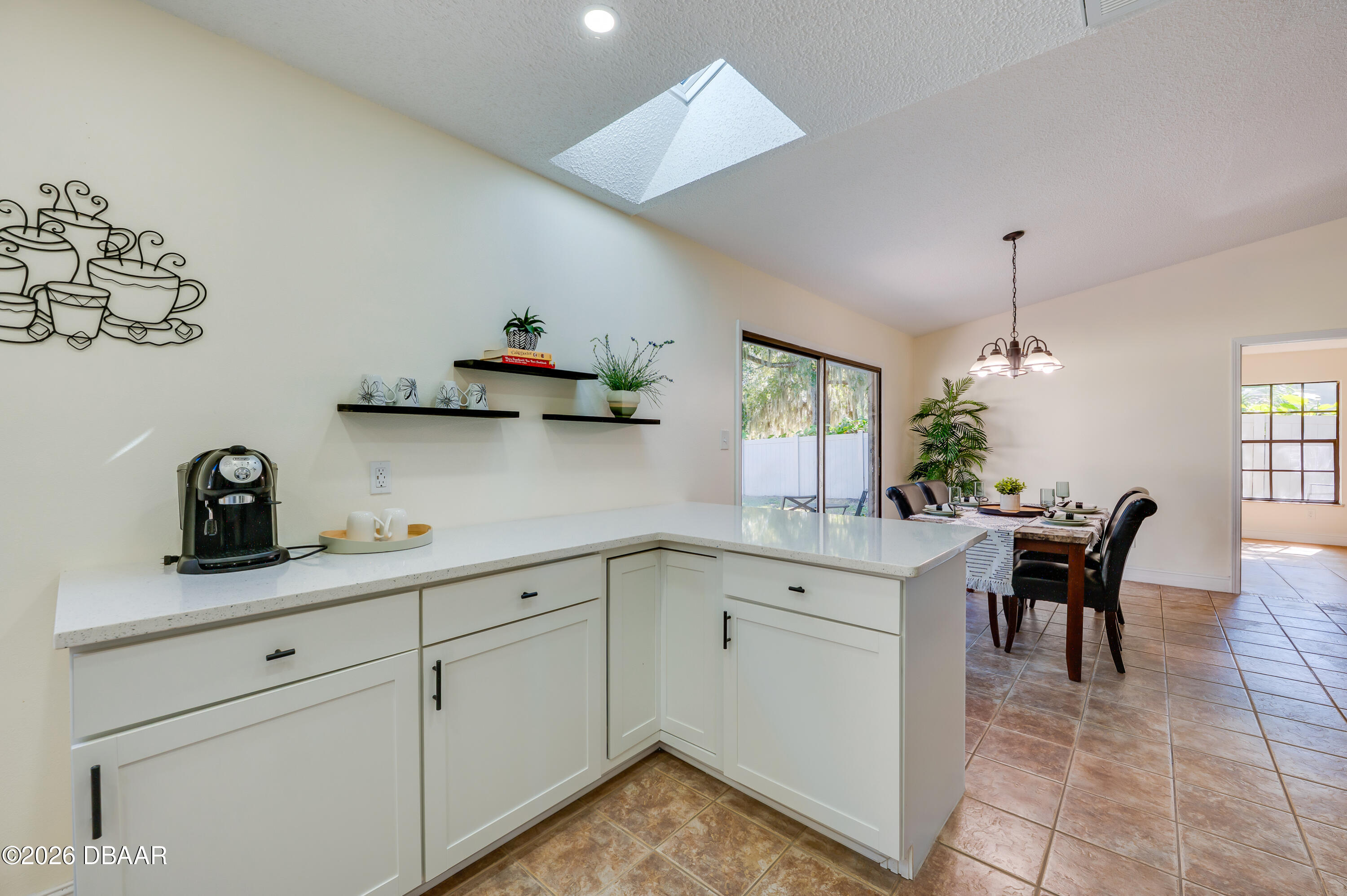 2425 Royal Palm Drive Edgewater, FL 32141 - Photo 15 of 41 a kitchen with cabinets and window