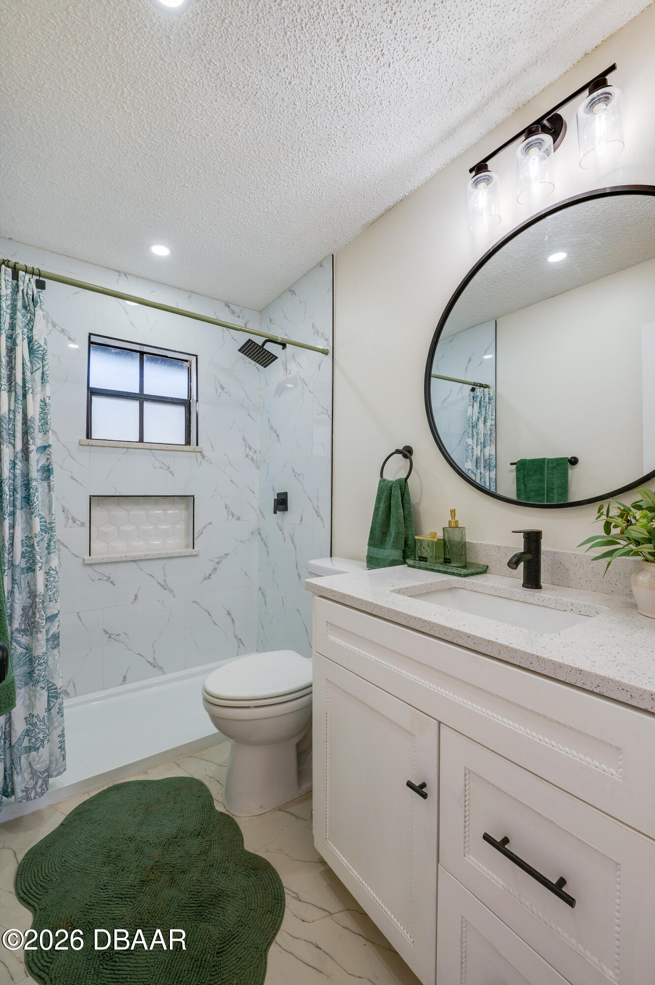 2425 Royal Palm Drive Edgewater, FL 32141 - Photo 20 of 41 a bathroom with a toilet a sink and mirror