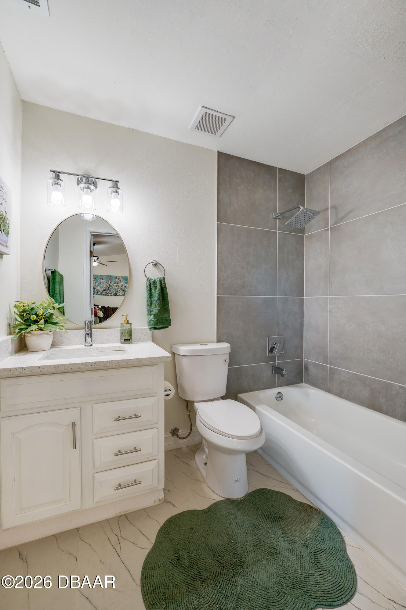 2425 Royal Palm Drive Edgewater, FL 32141 - Photo 29 of 41 a bathroom with a toilet a sink and bathtub