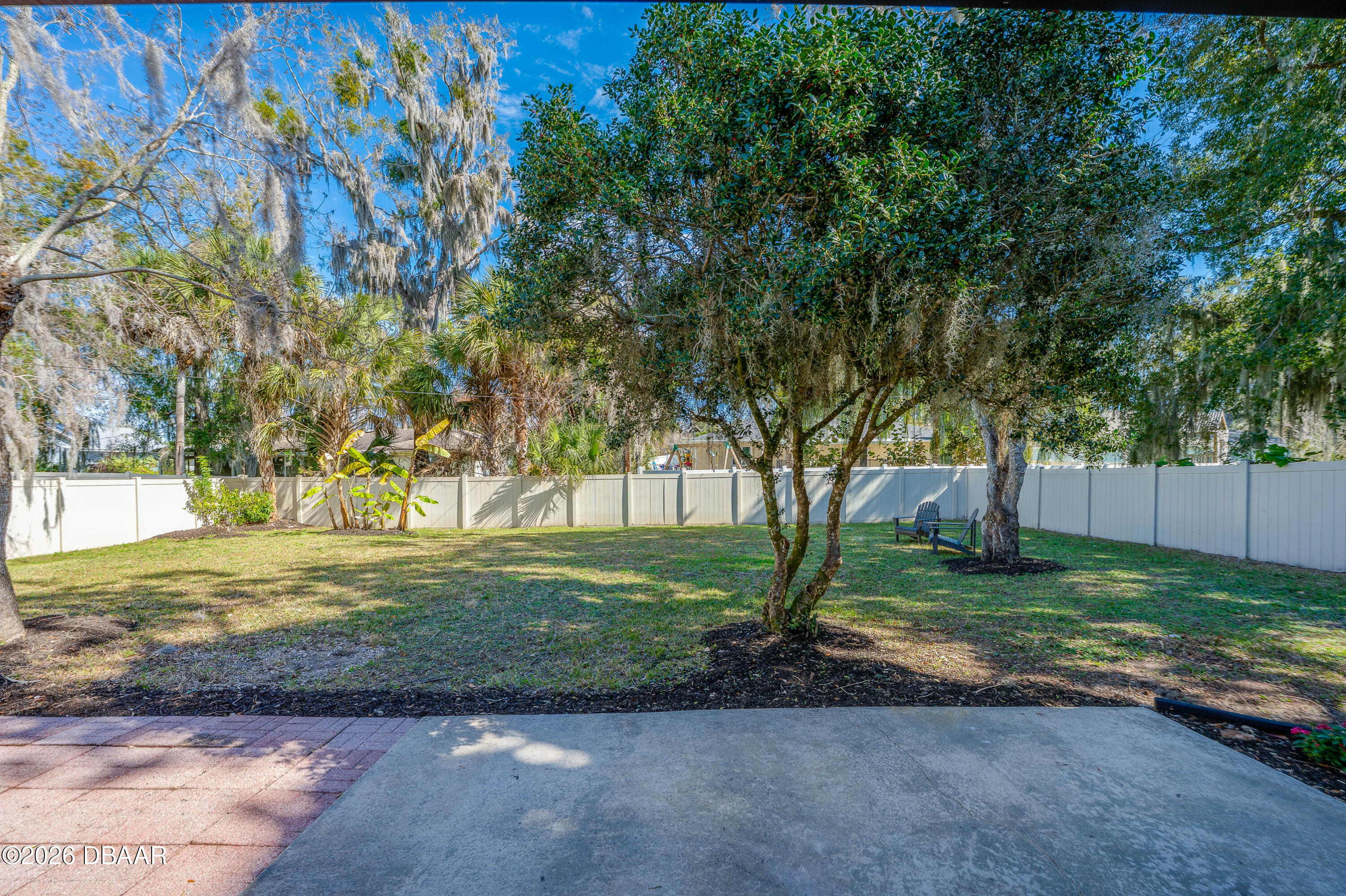 2425 Royal Palm Drive Edgewater, FL 32141 - Photo 32 of 41 a view of a yard with plants and trees