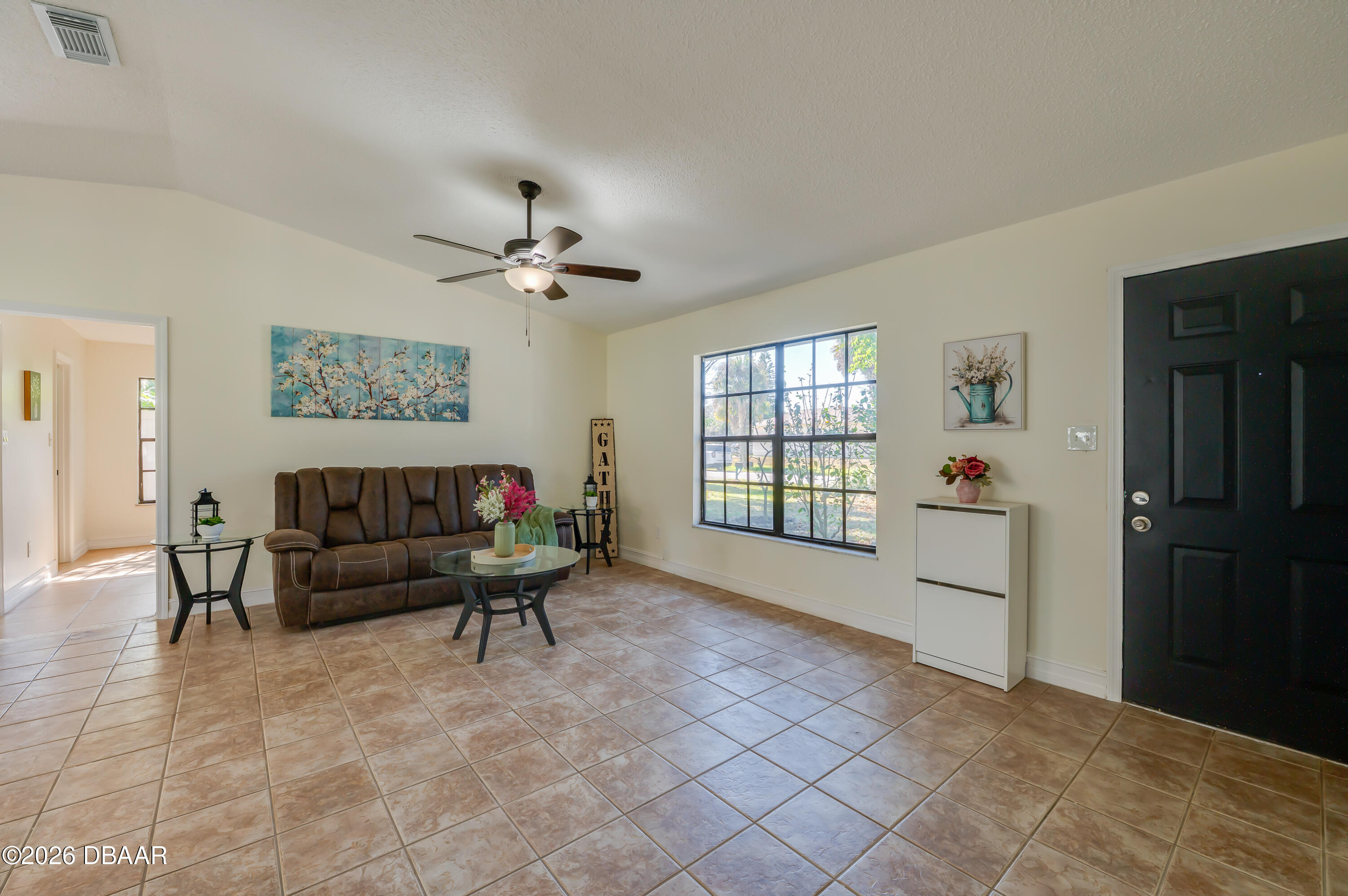 2425 Royal Palm Drive Edgewater, FL 32141 - Photo 6 of 41 a living room with furniture and a window
