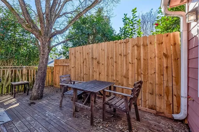 a view of a chairs and table in the patio