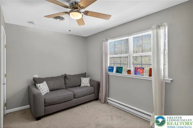 a bathroom with a granite countertop sink vanity and mirror