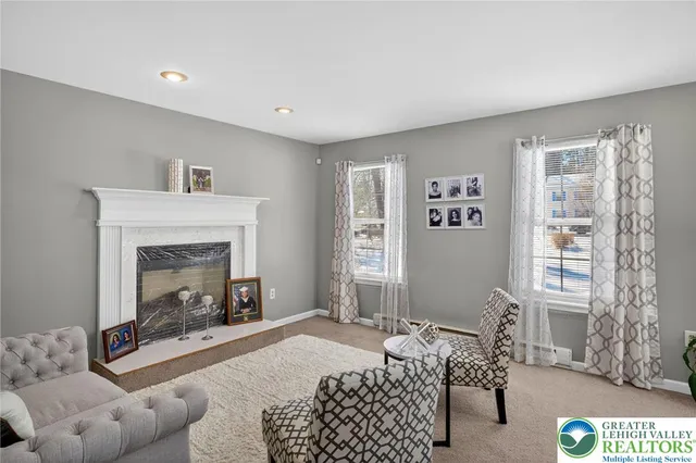 a bedroom with furniture and a fireplace