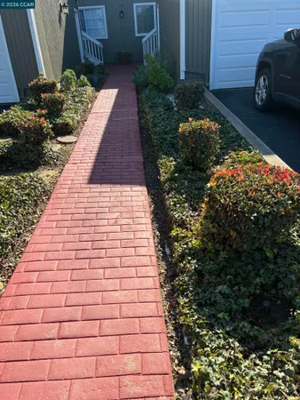 a view of a pathway with a house