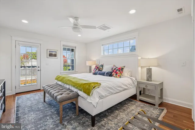 a bedroom with a bed and a lamp with window