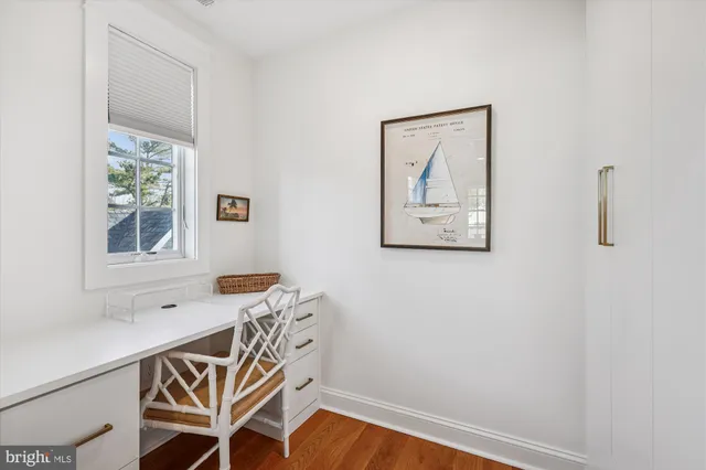 a view of a room with furniture and windows