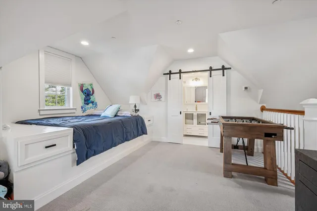 a bedroom with furniture and a window