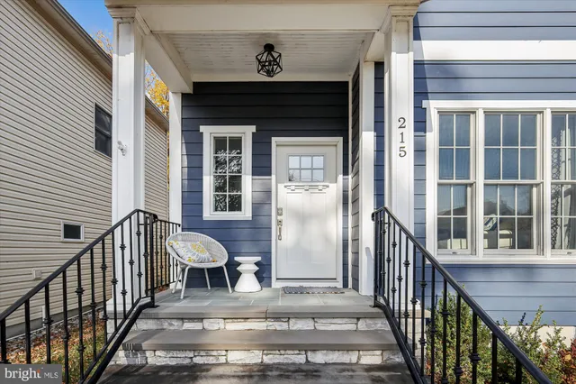 a view of a balcony with furniture and wooden floor