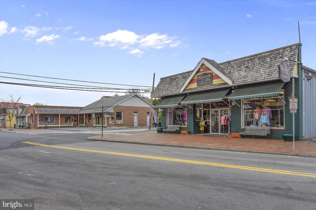 a front view of a building and a umbrellas