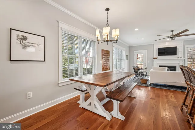 a room with pool table and windows