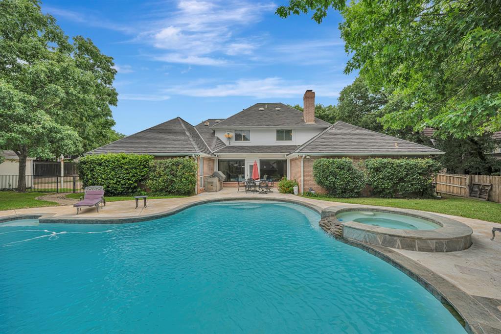 4008 Ramsgate Court Colleyville, TX 76034 - Photo 2 of 33 Resort-style backyard featuring a freeform swimming pool with integrated spa and stone surround