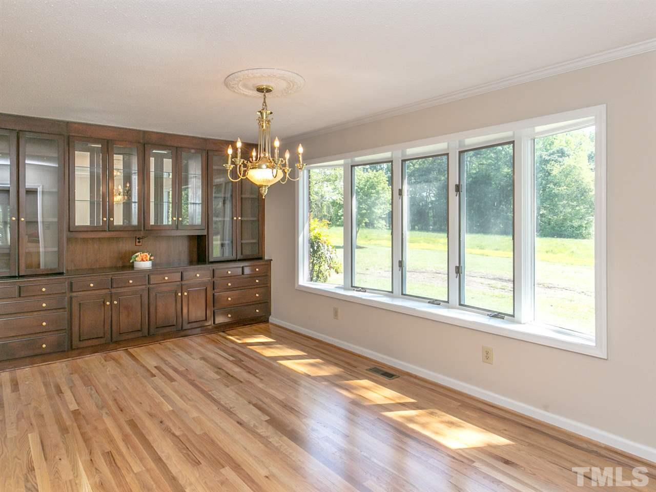 2524 Win Road Garner, NC 27529 - Photo 4 of 25 Beautiful built-in custom cabinet with glass doors and drawers. Bay window facing large front yard.
