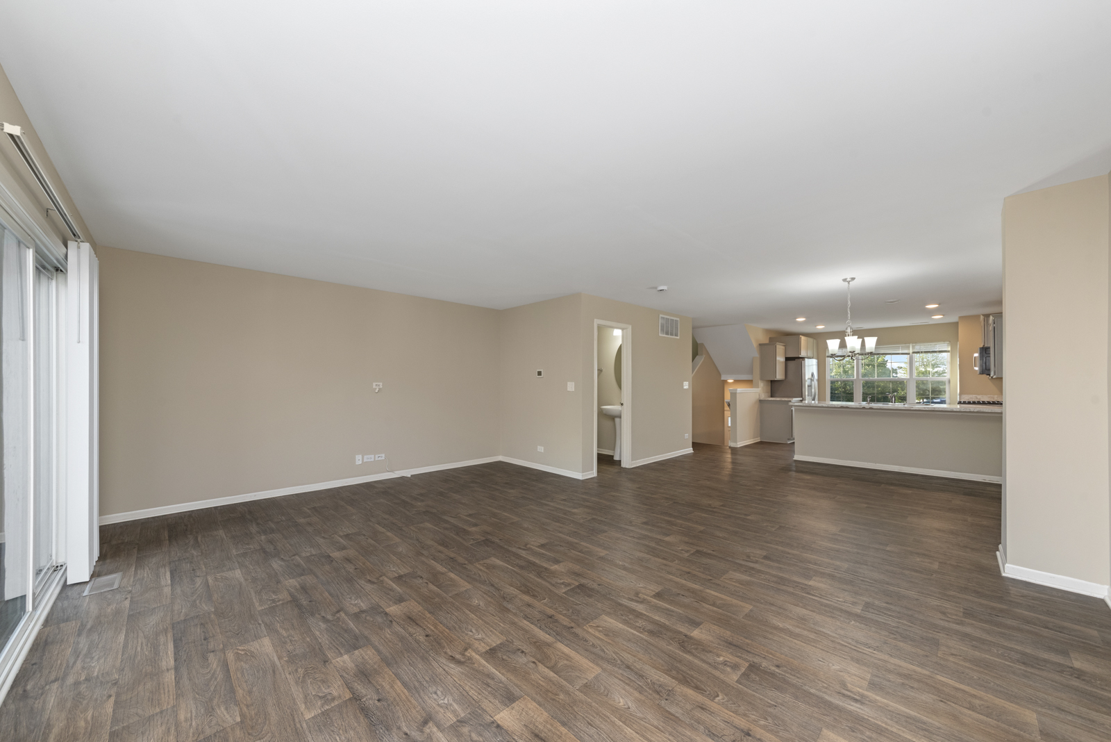 2303 Upland Road Pingree Grove, IL 60140 - Photo 6 of 17 wooden floor in an empty room with a window