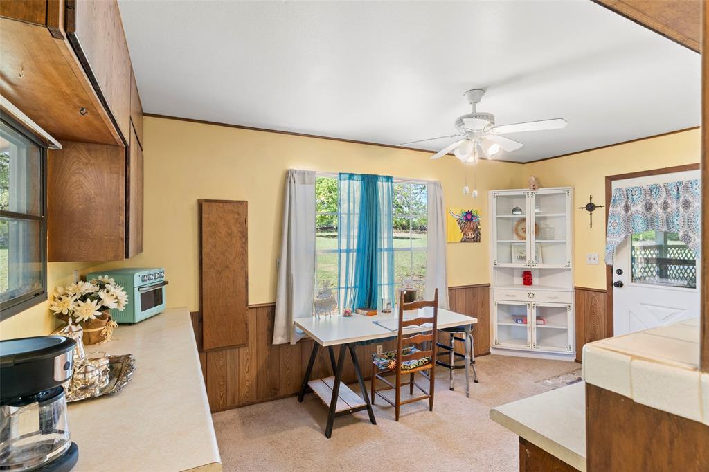 1500 County Road 404 Comanche, TX 76442 - Photo 14 of 39 a view of a dining room with furniture window and outside view