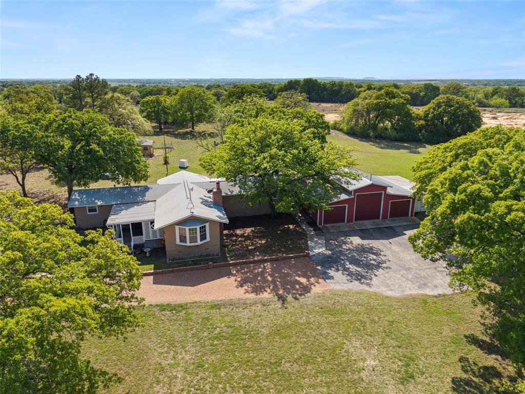 1500 County Road 404 Comanche, TX 76442 - Photo 2 of 39 a aerial view of a house with a garden
