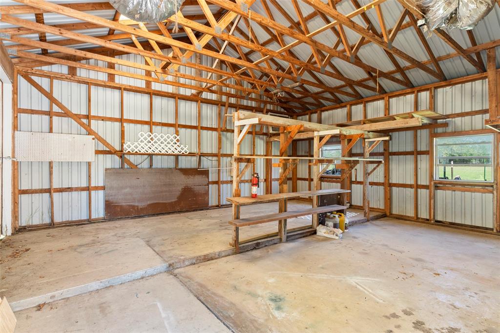1500 County Road 404 Comanche, TX 76442 - Photo 25 of 39 Miscellaneous room with metal wall and unfinished concrete floors