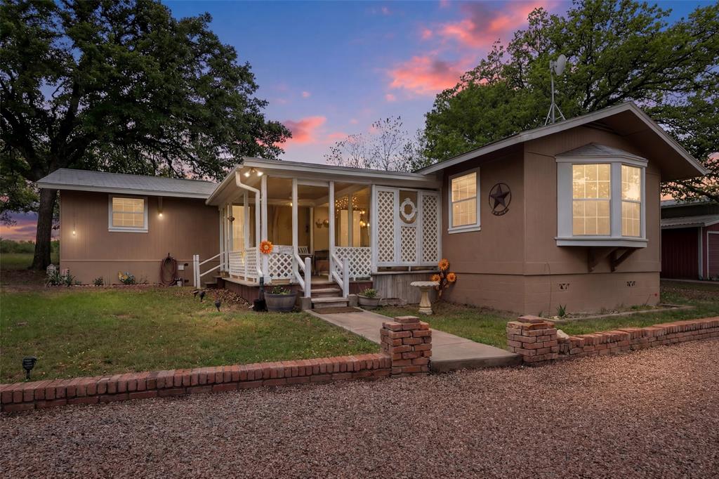 1500 County Road 404 Comanche, TX 76442 - Photo 5 of 39 a view of a house with backyard and a tree