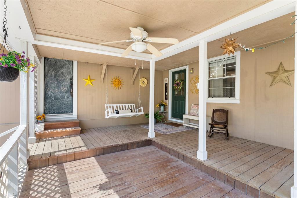 1500 County Road 404 Comanche, TX 76442 - Photo 6 of 39 a view of a hallway with wooden floor and a potted plant