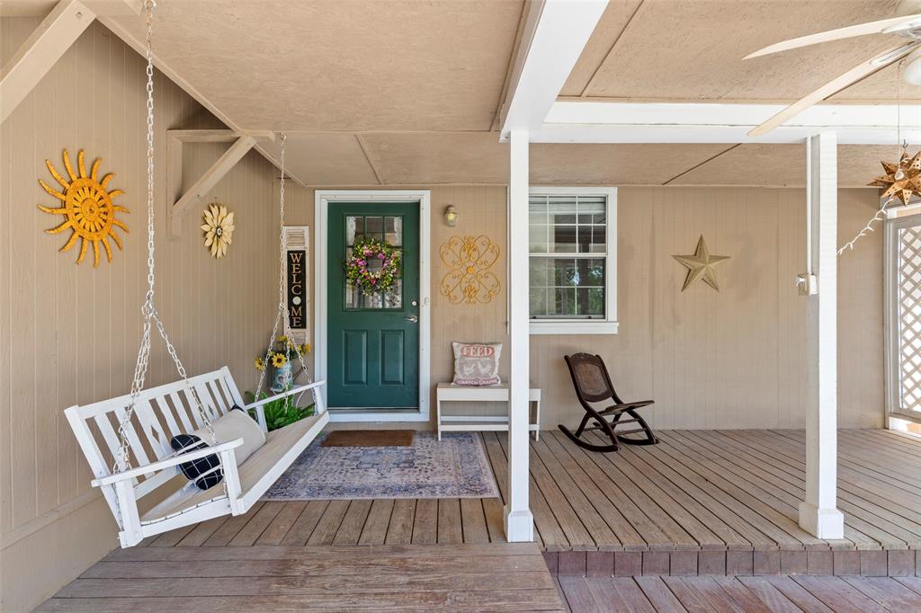 1500 County Road 404 Comanche, TX 76442 - Photo 7 of 39 a view of a house with a chairs and wooden floor