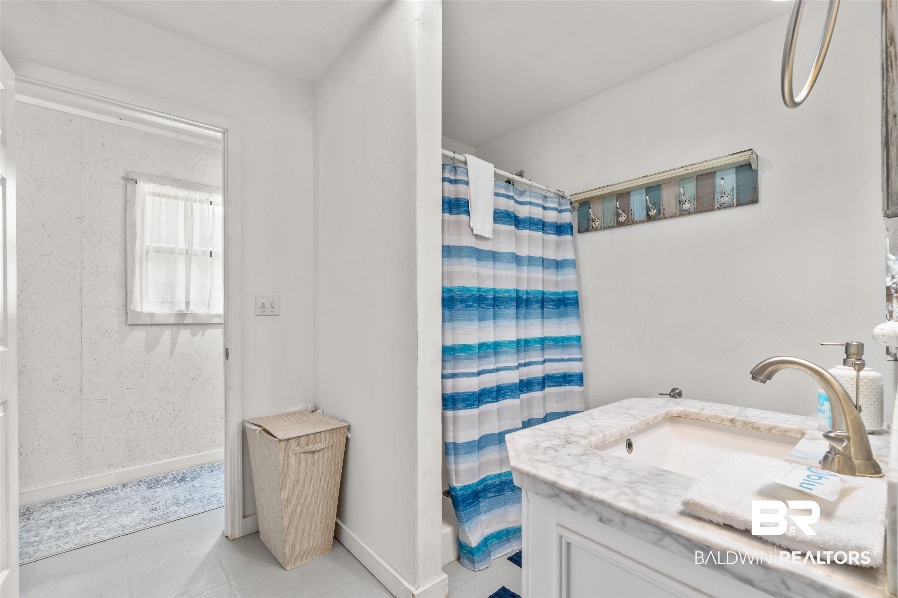 17595 River Road Summerdale, AL 36580 - Photo 12 of 29 Full bath featuring vanity, a shower with shower curtain, and light tile patterned floors