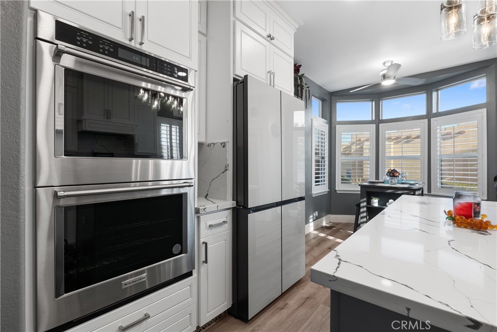 1188 Beach Drive Needles, CA 92363 - Photo 11 of 41 a kitchen with a sink stove and refrigerator