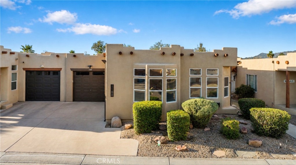 1188 Beach Drive Needles, CA 92363 - Photo 2 of 41 a front view of a house with garden