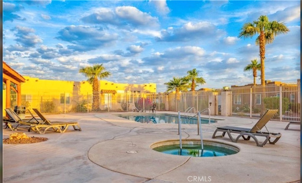 1188 Beach Drive Needles, CA 92363 - Photo 33 of 41 a swimming pool with outdoor seating