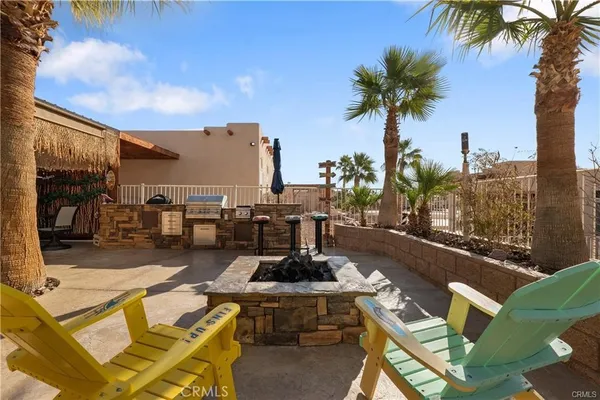 a view of a patio with swimming pool