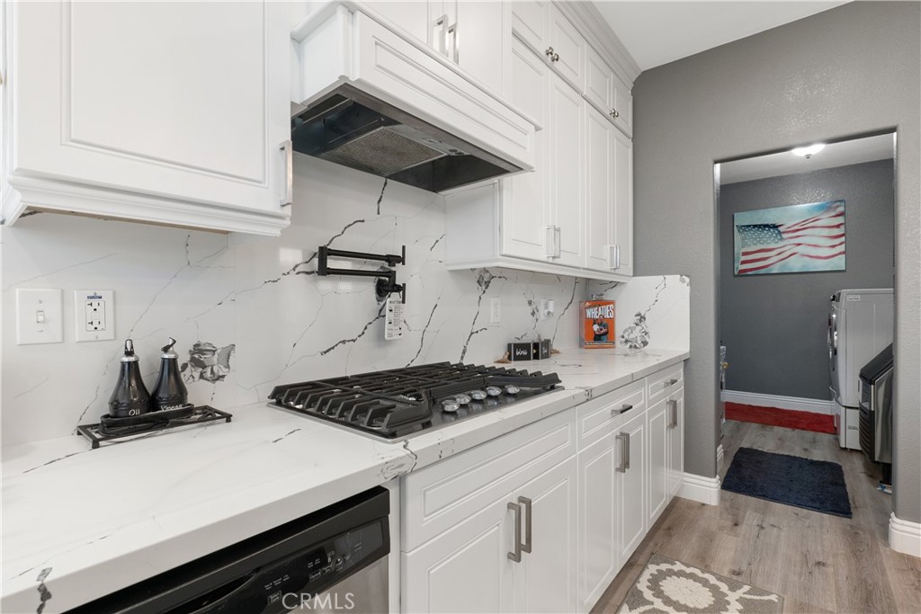 1188 Beach Drive Needles, CA 92363 - Photo 7 of 41 a kitchen with a stove and cabinets