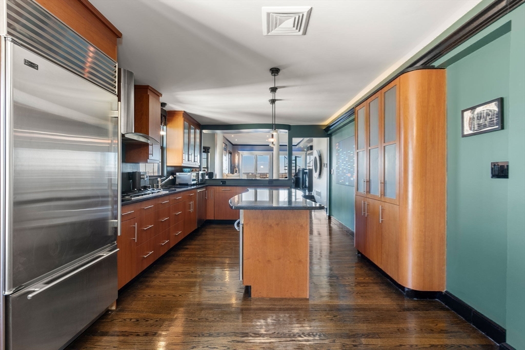 227 Summit Avenue, Unit E401 Brookline, MA 02446 - Photo 15 of 38 a kitchen with stainless steel appliances granite countertop a refrigerator a sink dishwasher a stove and a refrigerator