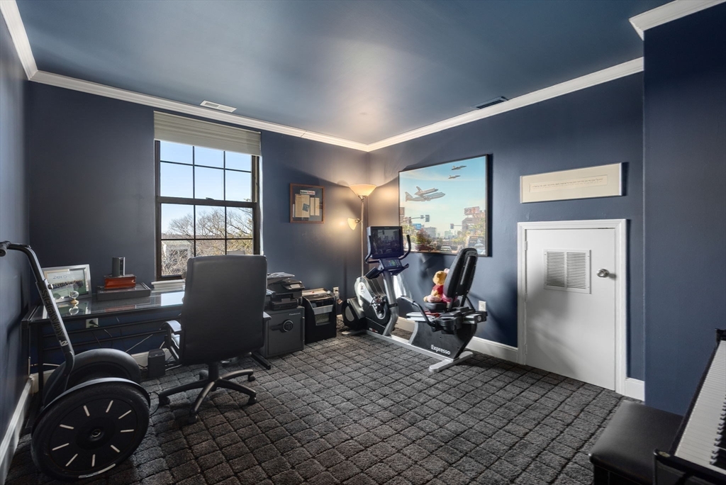 227 Summit Avenue, Unit E401 Brookline, MA 02446 - Photo 24 of 38 a view of a workspace with furniture and a window