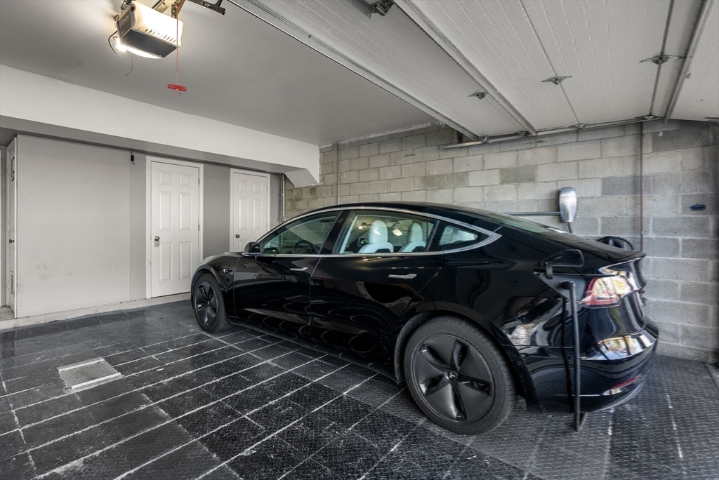 227 Summit Avenue, Unit E401 Brookline, MA 02446 - Photo 28 of 38 a car parked in a garage