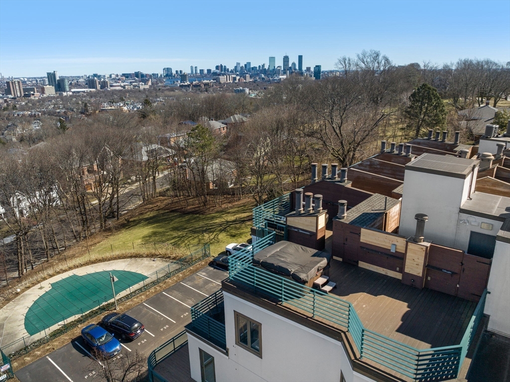 227 Summit Avenue, Unit E401 Brookline, MA 02446 - Photo 34 of 38 a view of a swimming pool with lounge chair
