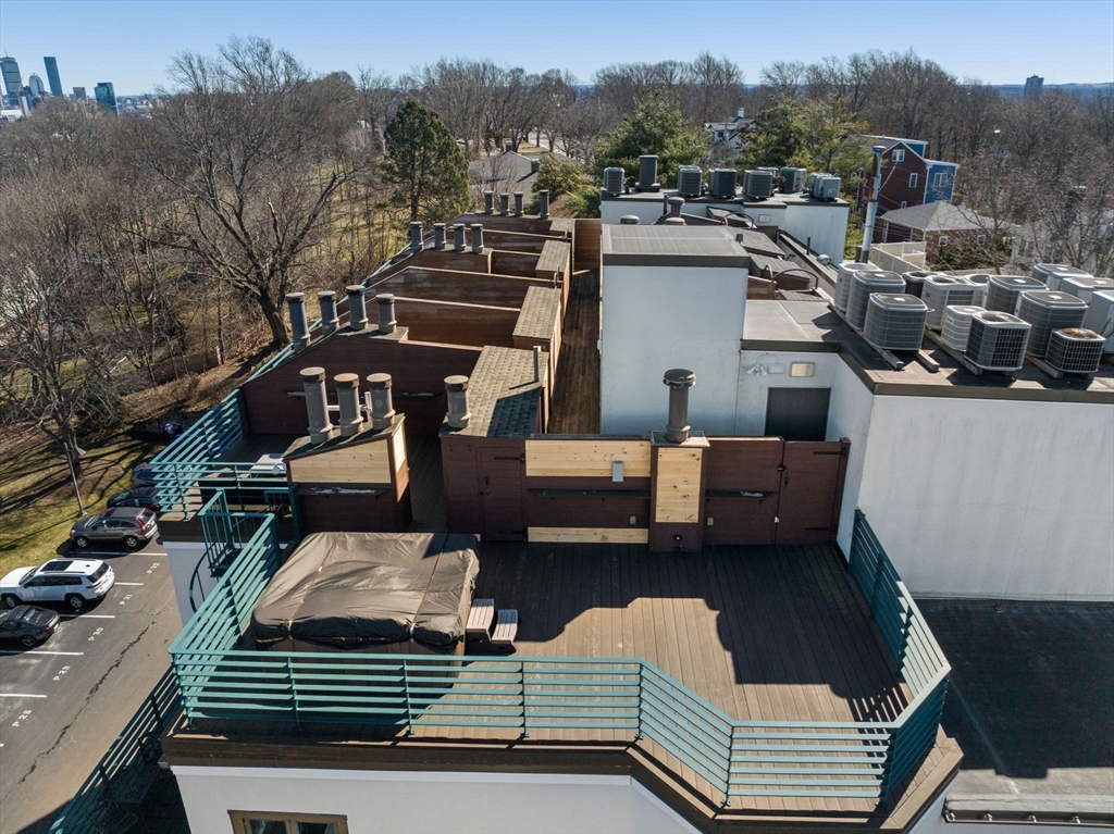227 Summit Avenue, Unit E401 Brookline, MA 02446 - Photo 36 of 38 a view of a roof deck with couches