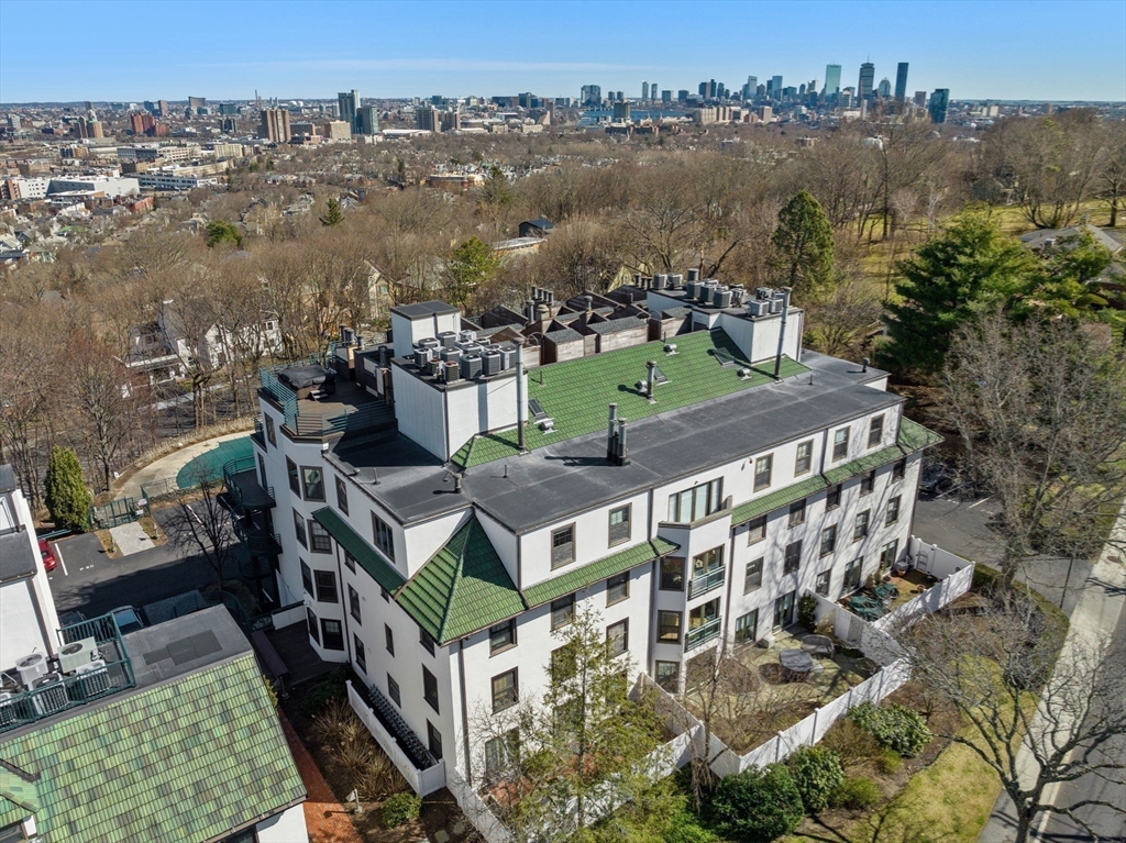 227 Summit Avenue, Unit E401 Brookline, MA 02446 - Photo 38 of 38 an aerial view of a house with a garden and lake view
