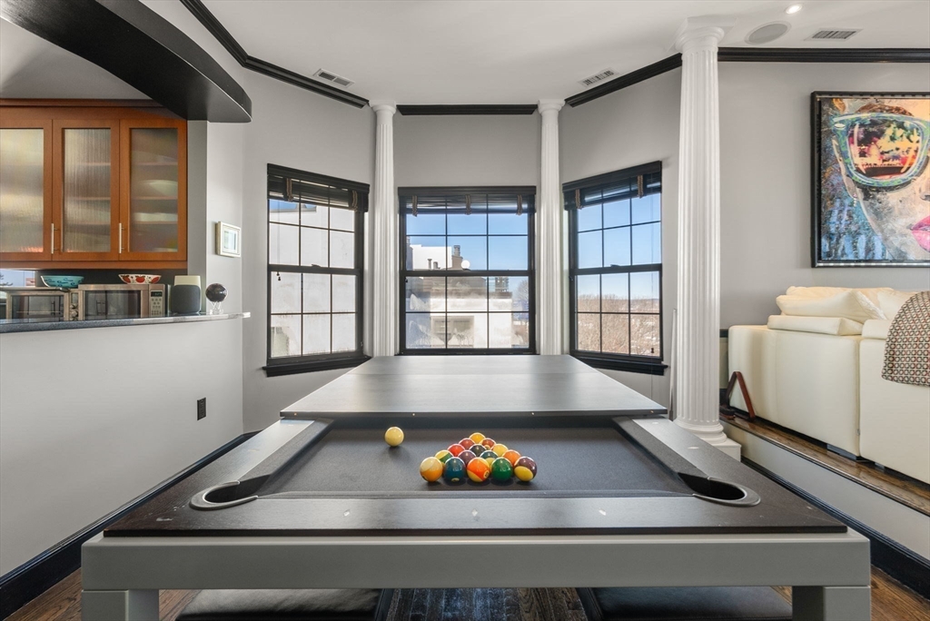 227 Summit Avenue, Unit E401 Brookline, MA 02446 - Photo 6 of 38 a room with pool table and windows