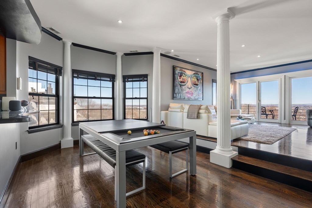227 Summit Avenue, Unit E401 Brookline, MA 02446 - Photo 7 of 38 a living room with furniture and windows